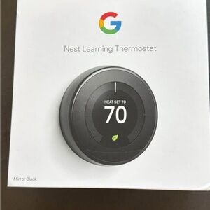 3rd generation Google Nest Thermostat in Mirror Black. NWT